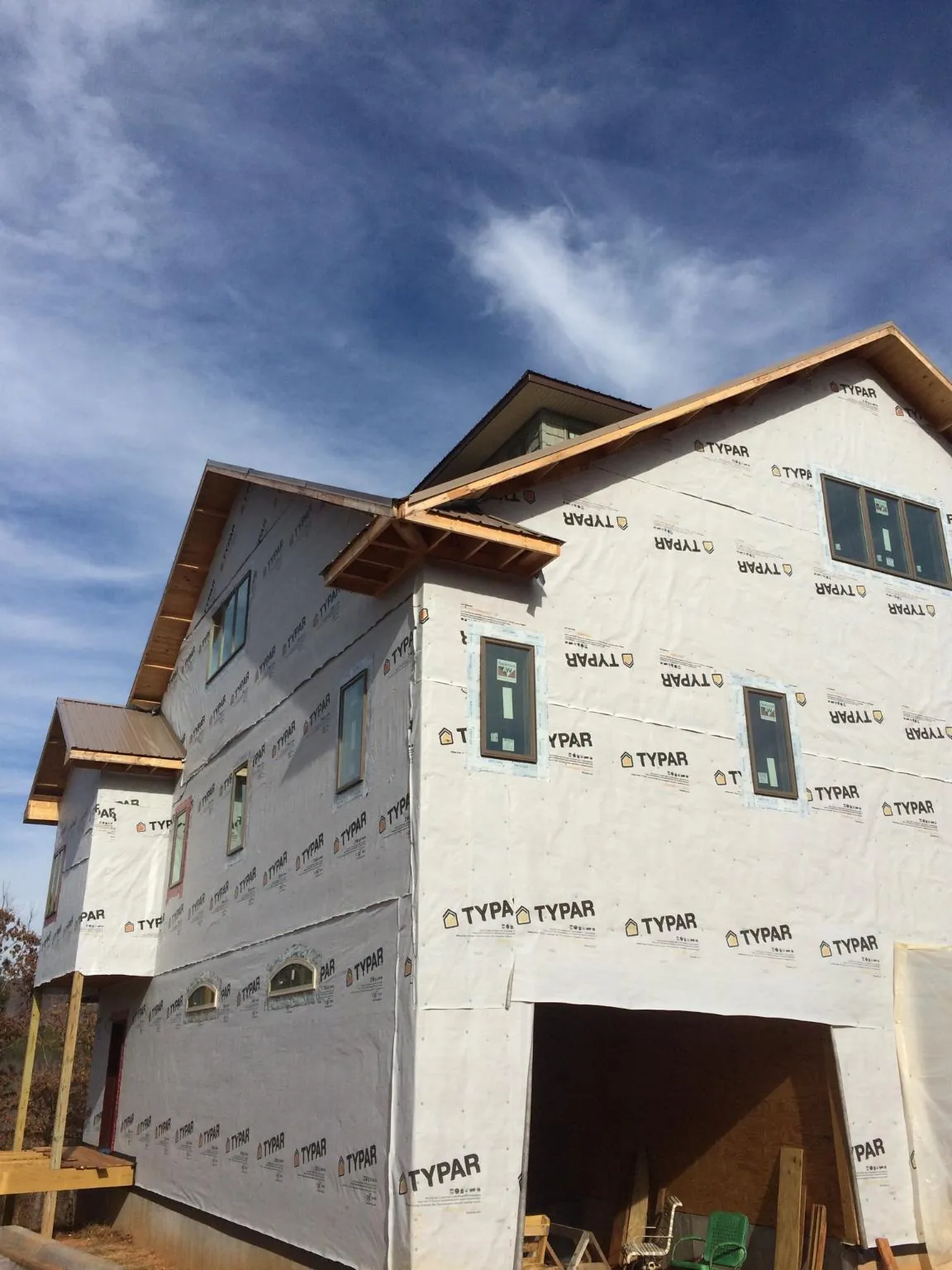 Stick built house wrapped in Typar with new roof framing and dormers in Wharton
